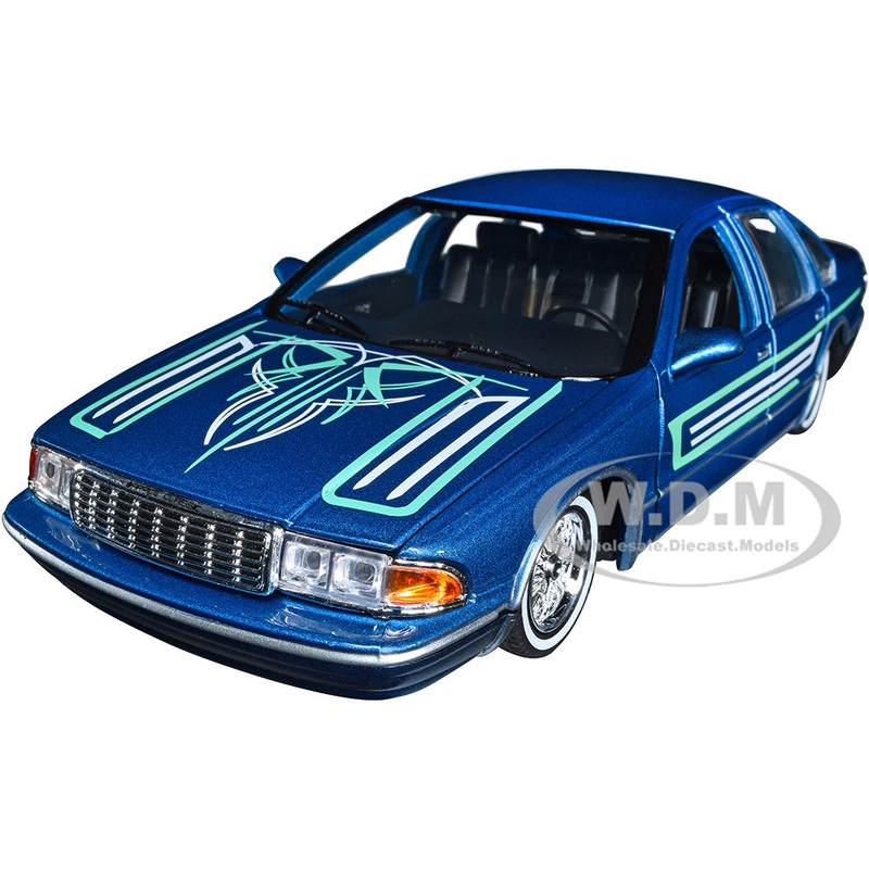1993 Chevrolet Caprice Lowrider Blue Metallic with Graphics Get Low Series 1/24 Diecast Model Car by Motormax